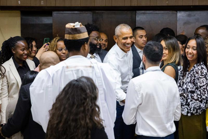 President Barack Obama greets Obama Scholars during their graduation convening in Chicago on May 10, 2023 (The Obama Foundation)