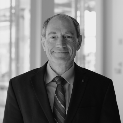 A headshot of David Caughlin